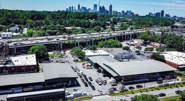 Drone shot over Interstate 85 in Atlanta Georgia showing Carolina Lumber & Supply